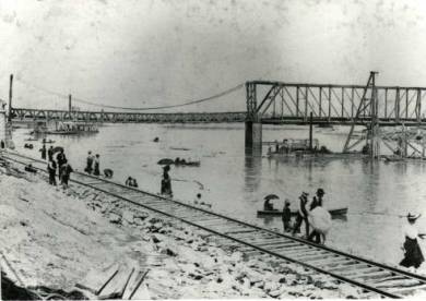 1903 Flood of Kansas River at 12th Street Bridge. Sightseers along Kansas River at 12th Street Bridge. 