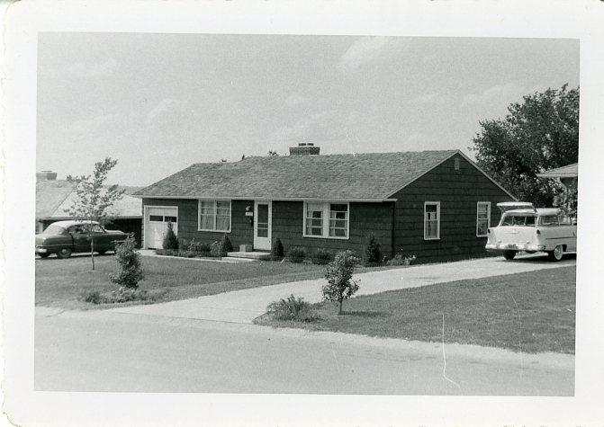An image of the American Dream: a new Prairie Village home with a car in the driveway. Johnson County Museum.